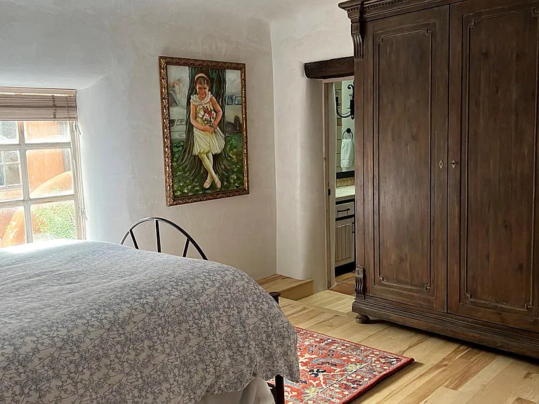 Large armoire with space to hang clothes.