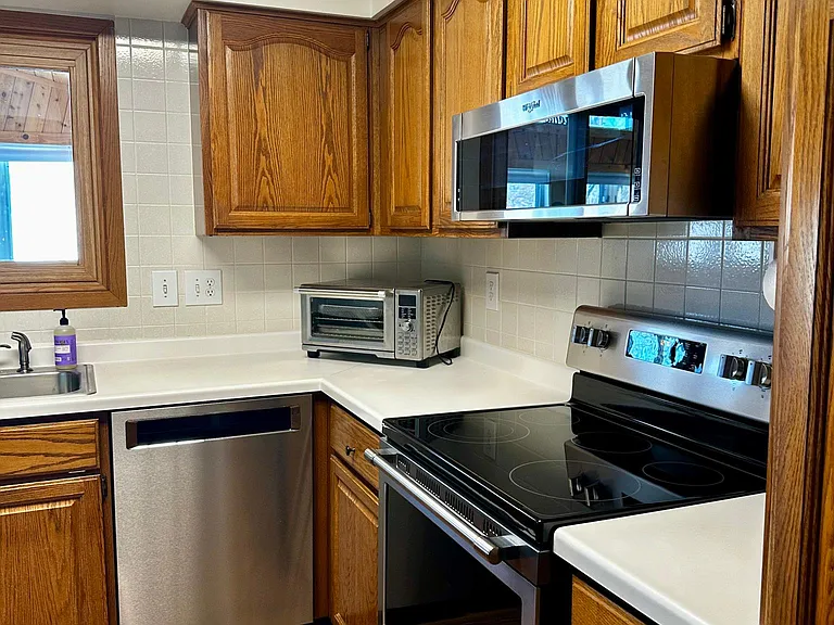 Dishwasher, stove, microwave, and air fryer included