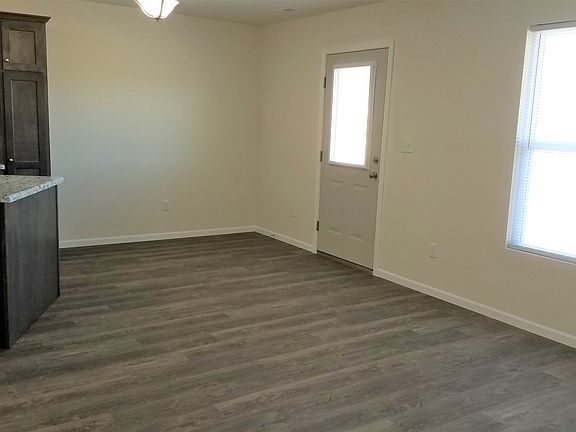 Living Room w/ door to concrete patio