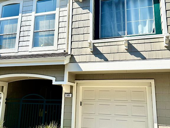 Front of unit with one-car garage.