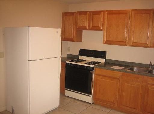 Custom cabinets with gas stoves in all units