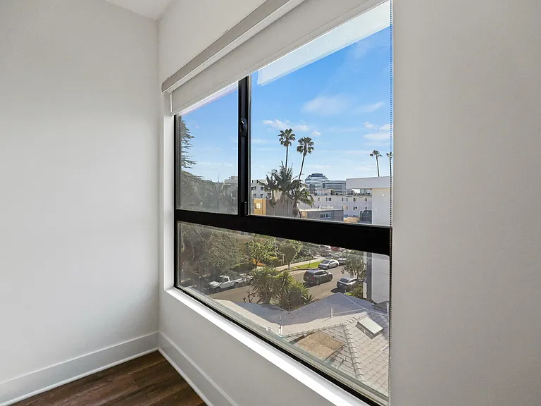 Bedroom with Large Windows with Views of the City