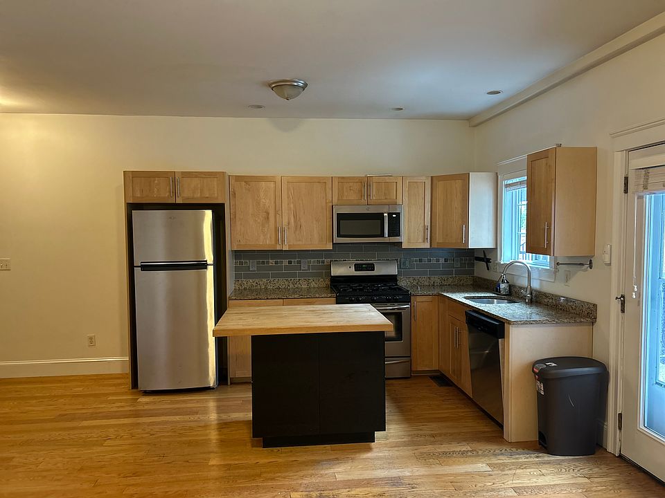 Kitchen with granite counters, butcher block island and easy access to the deck and patio.