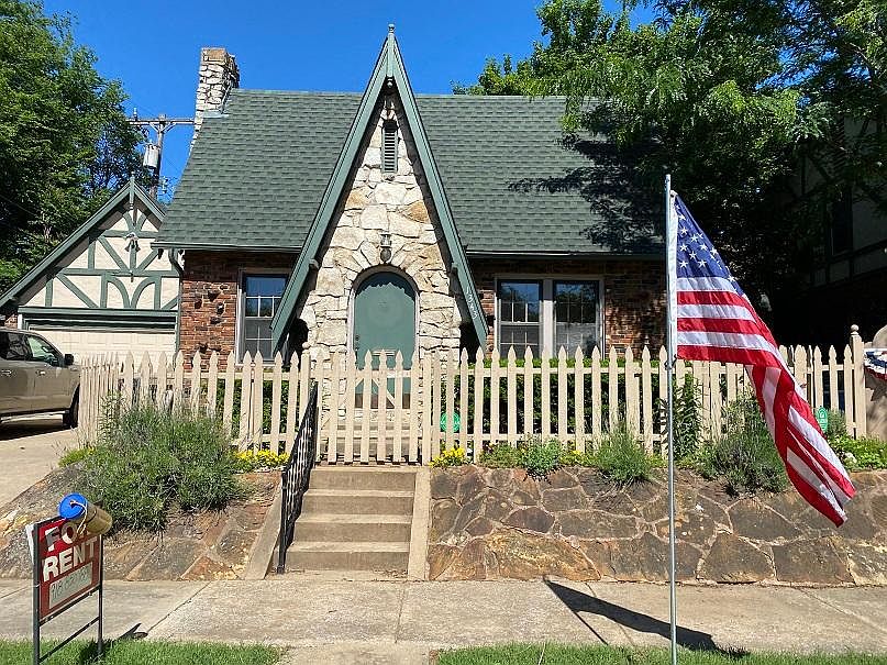 English Tudor with picket fencing allows for garden/flower areas and flagstone walkway. Well kept home built in 1929 with lots of extra charm. Security system paid by property owner.