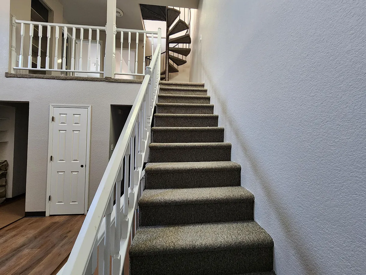Stairs to second floor and spiral stairs to third floor office or bedroom. New carpet - 1512 12th Ave #1
