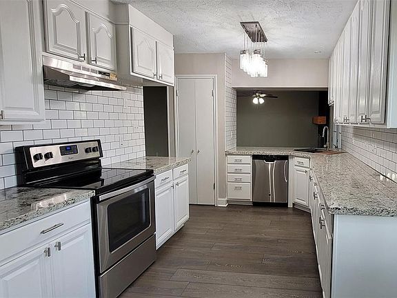 This kitchen offers so much storage and cabinet space! Truly a cooks dream! Open concept with breakfast bar to family room!
