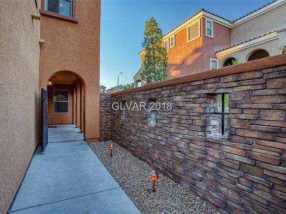 Arches and stone wall gated entry