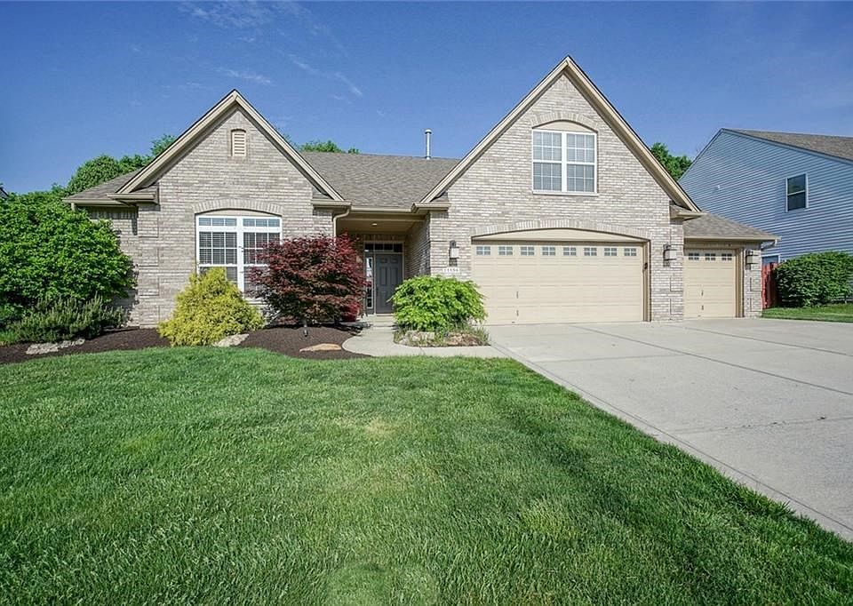 Attractive brick exterior & gorgeous landscaping.  It is the only home with this exterior in the community!