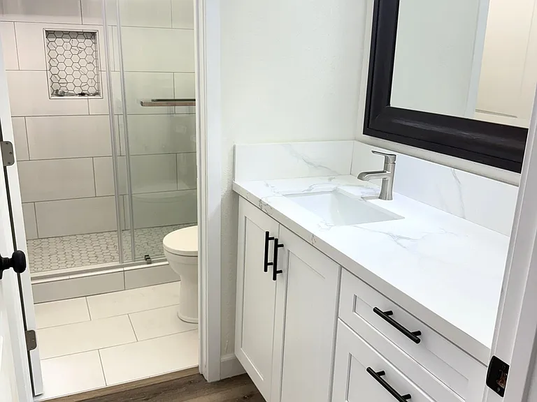 Primary bath showing shower in the back of photo