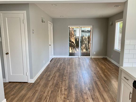 Living room room with 2 closet doors in view