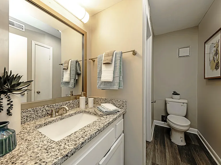 Bright bathroom with granite countertops