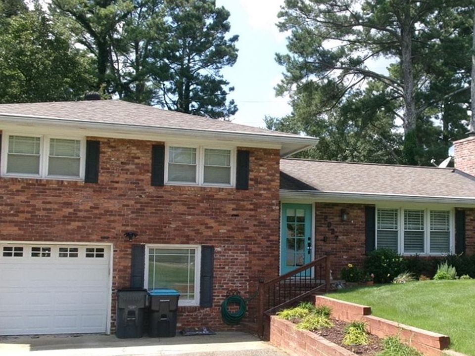 Front of house, newly paved driveway