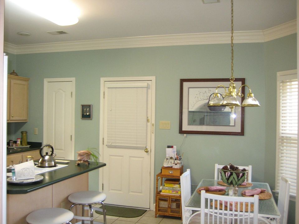 Kitchen with island is newly painted.