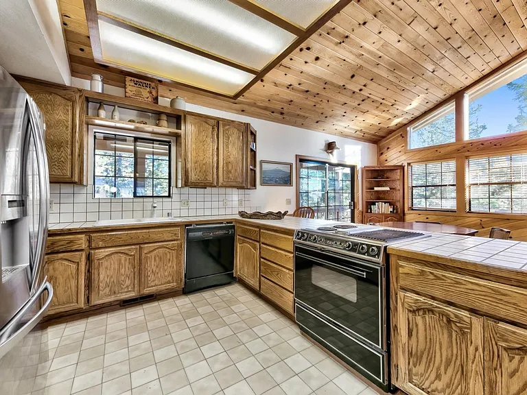 Open kitchen with electric stove.