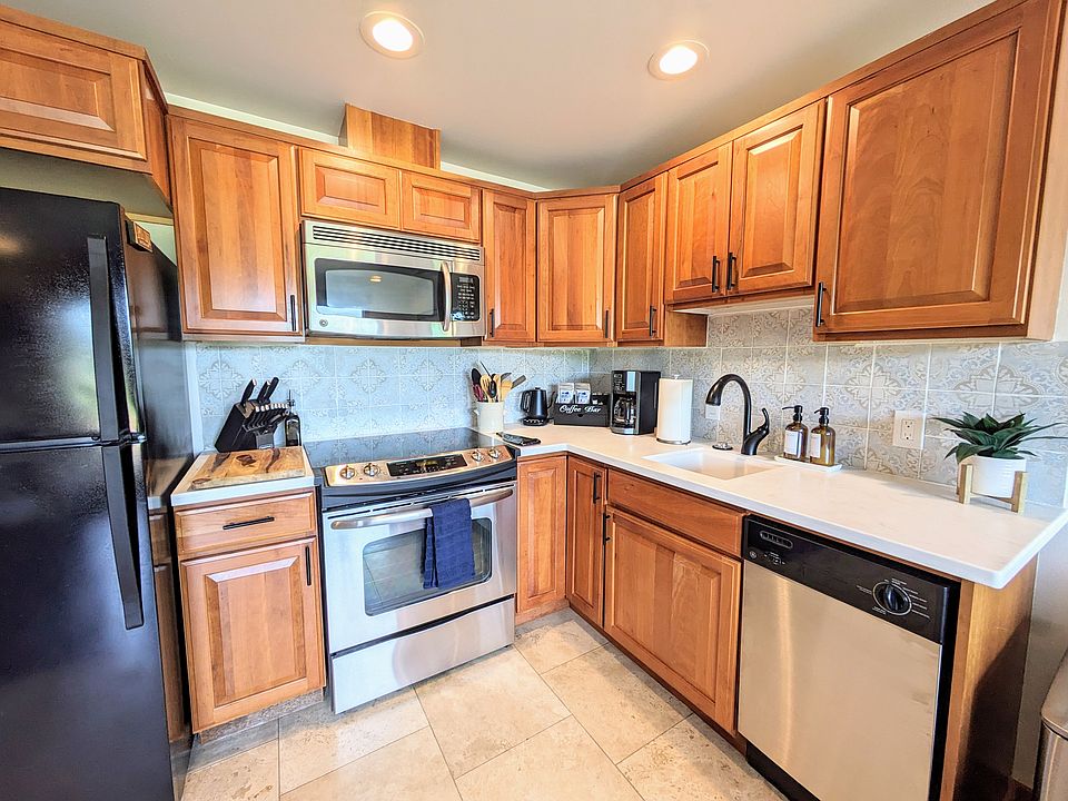 Fully stocked kitchen with all appliances - full sized refrigerator with ice maker, microwave, stove, oven, and dishwasher.