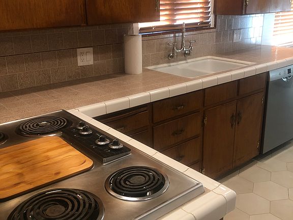 Kitchen-Aid stove-top. Slide out drawers throughout kitchen. Western exposure.