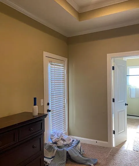 Door to outside patio, entrance to master bathroom