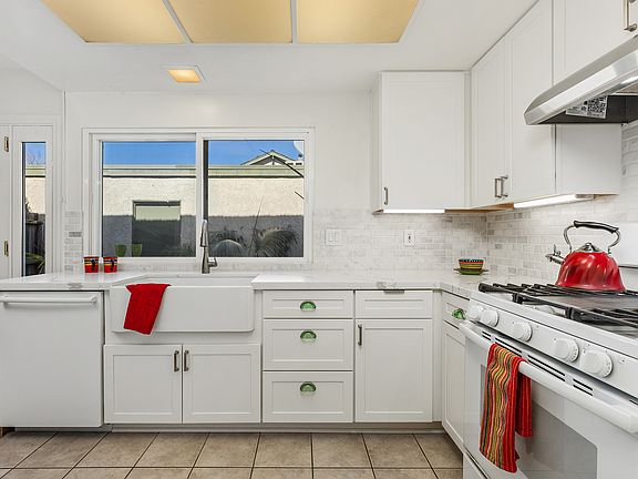 Quartz counter-tops, farm style sink, subway tile backsplash