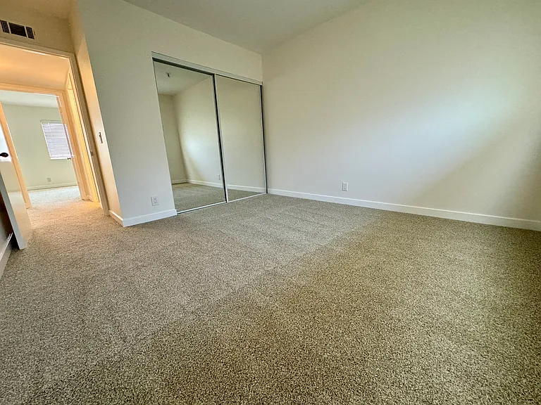 Bedroom number 2 with new mirrored wardrobe doors, carpet & paint!