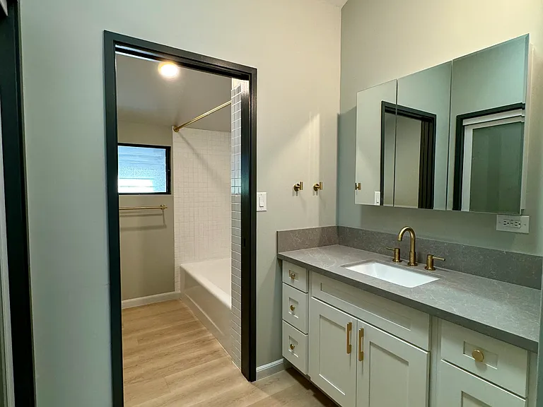 Upstairs bath #2. With tub shower and has additional closet.