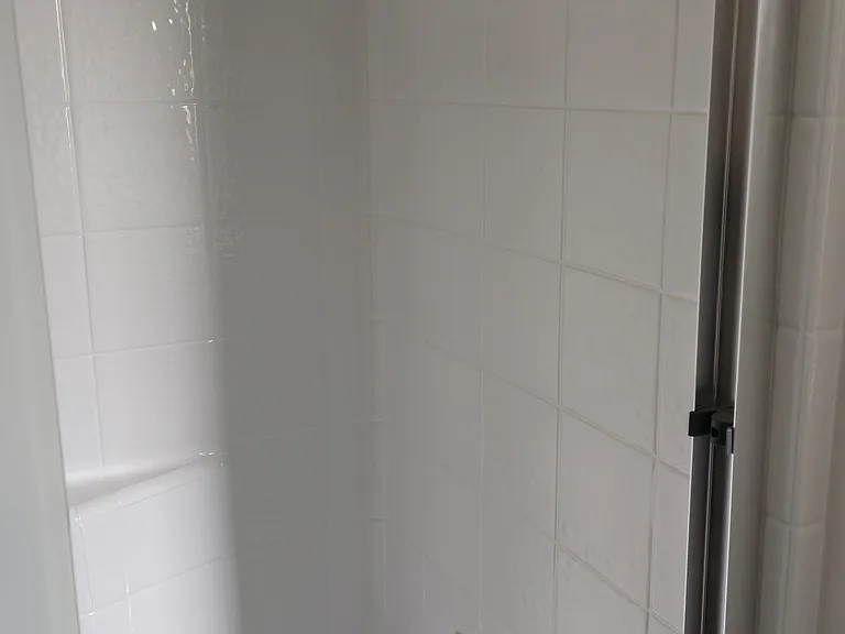 Master bathroom shower with sliding glass doors