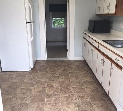 Kitchen, view into one bedroom
