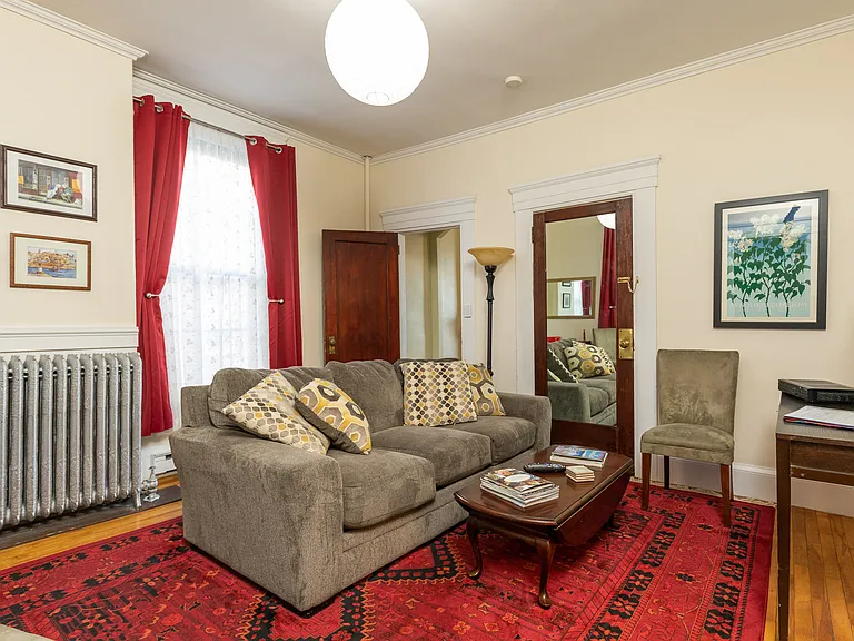 Living room with room-darkening curtains.