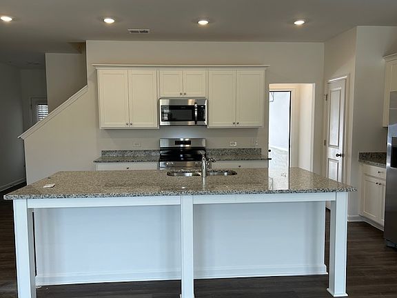 Spacious kitchen and a large granite top
