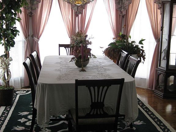 Great formal dining room with beautiful hardwood floors and bay window.