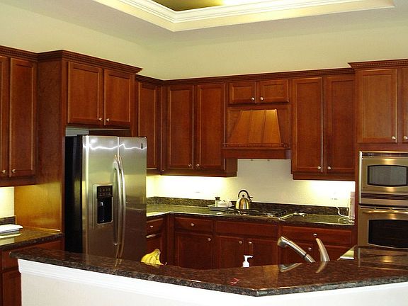 Kitchen has Cherry Cabinets and Granite counters