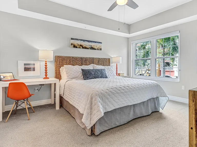 Primary bedroom suite with desk area