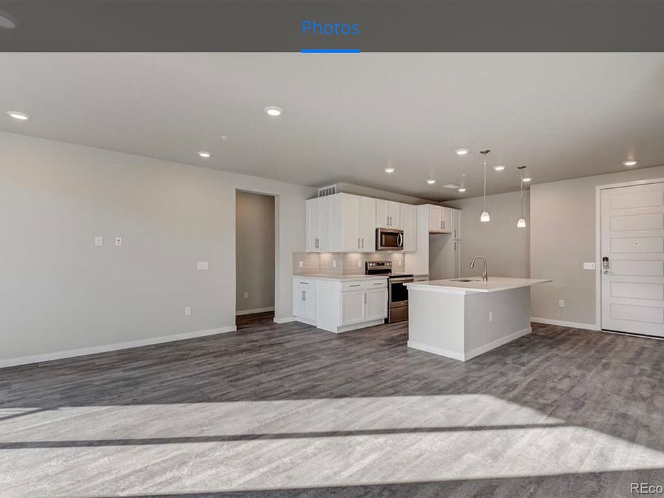 Livingroom - shows Master BR and Laundry room entrance on left