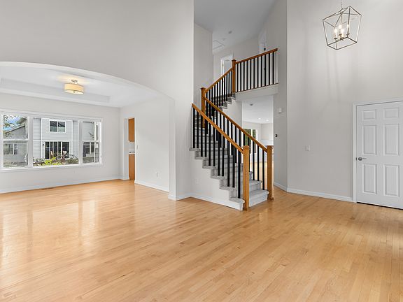 Freshly painted in a soft neutral palette that complements a variety of decor styles, with updated lighting throughout the first floor and a convenient coat closet for additional storage.