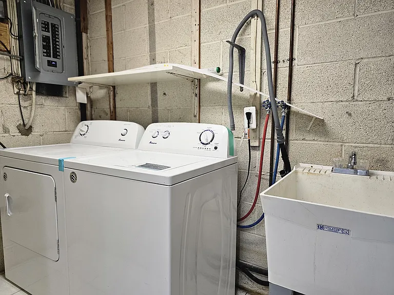 Separate washer drier and utility sink