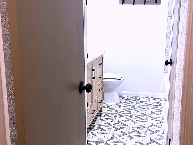 Bathroom - Built in linen storage behind the door, linen closet to the right