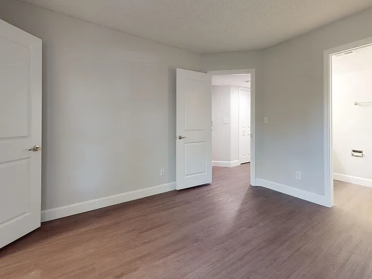 The Martinique floor plan features a spacious master bedroom with direct access to a private ensuite bath, modern flooring, and ample closet space.