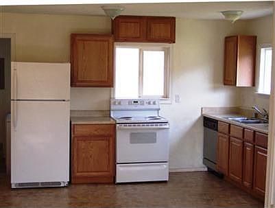 Open kitchen with newer appliances.
