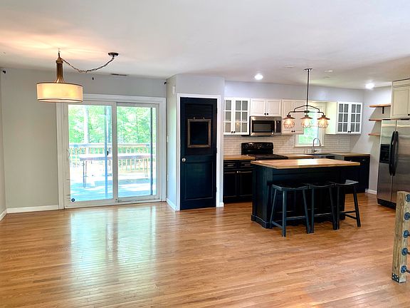 Open concept- dining room area leads out to 12 x 12 deck - tons of natural light and space for hosting.