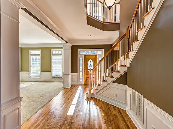 Foyer with dual staircase