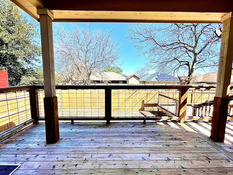 Backyard comes with two large wooden decks and a pergola patio