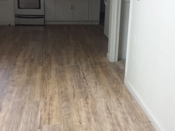 Brand new stove and cabinets and beautiful flooring.