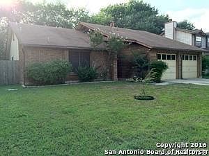 7275 Shadowridge Front of house. The grass doesn't look this green now.