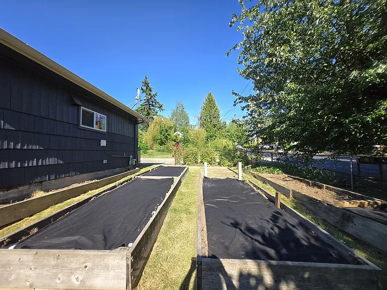 Huge garden beds on the southside of the home with great sun exposure.