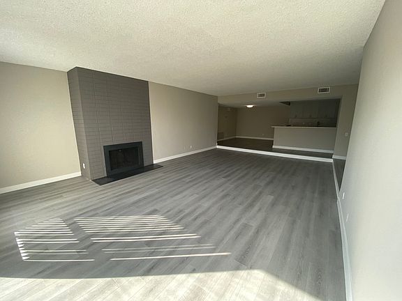 11858 Goshen Ave Unit 207 living room with fireplace