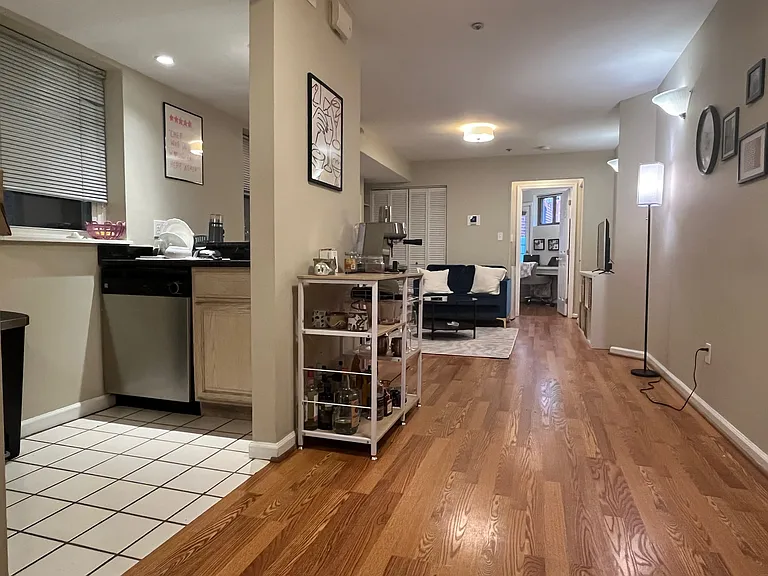 Living/dining room with Kitchen entrance on left