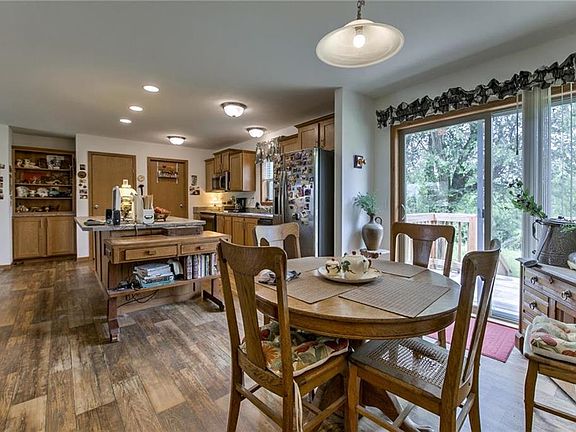 Dining room is open to the island Kitchen.  Pantry plus island and cabinets offer lots of storage.