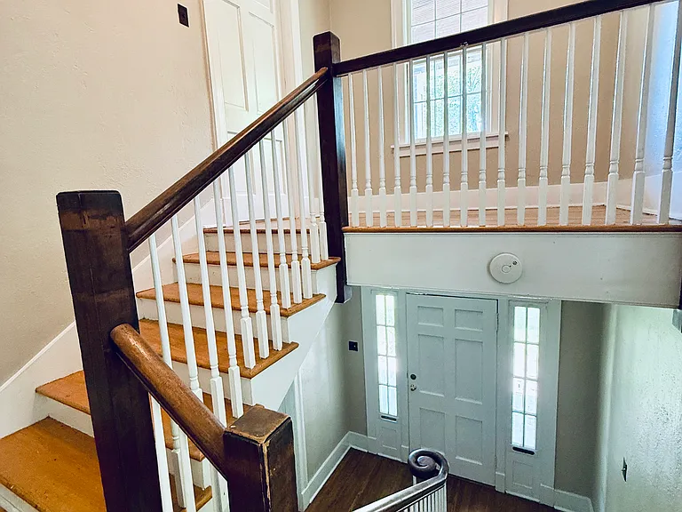 Wide stairway going up to the apartment