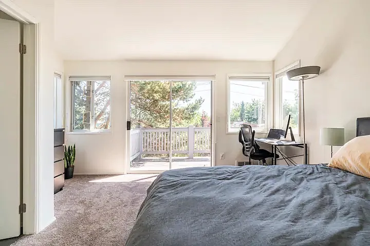 Master bedroom with a view of the front deck
