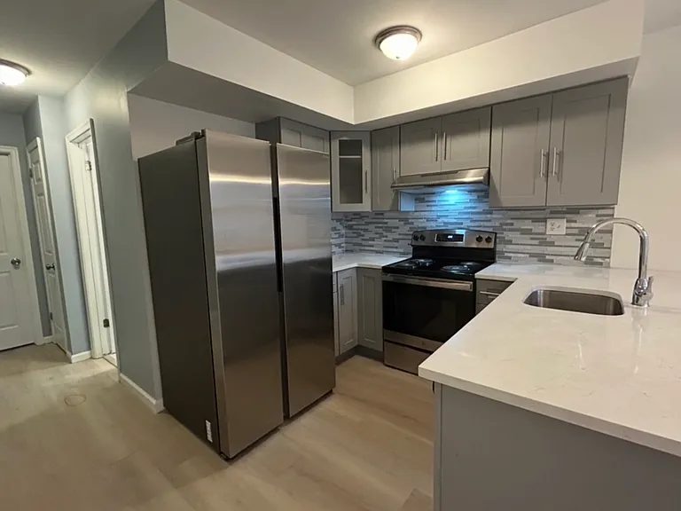 New sleek large refrigerator and stainless steel appliances