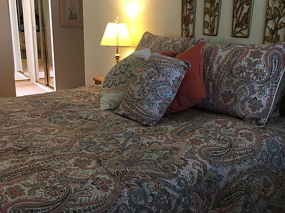 Master queen bedroom view toward closet area & master bath. Same room, different comforter. Separate a/c & heat unit. Flat screen TV.